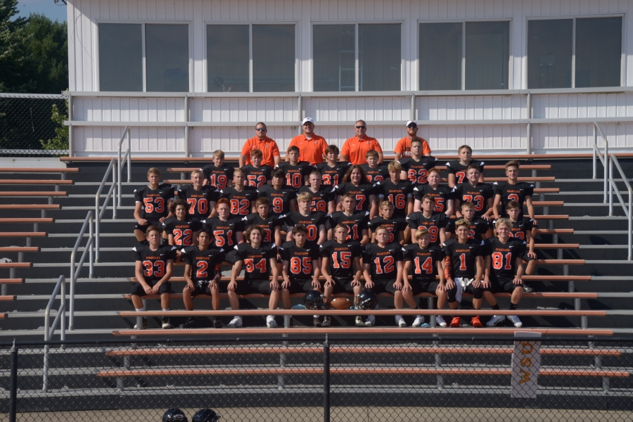 football team sitting in bleachers